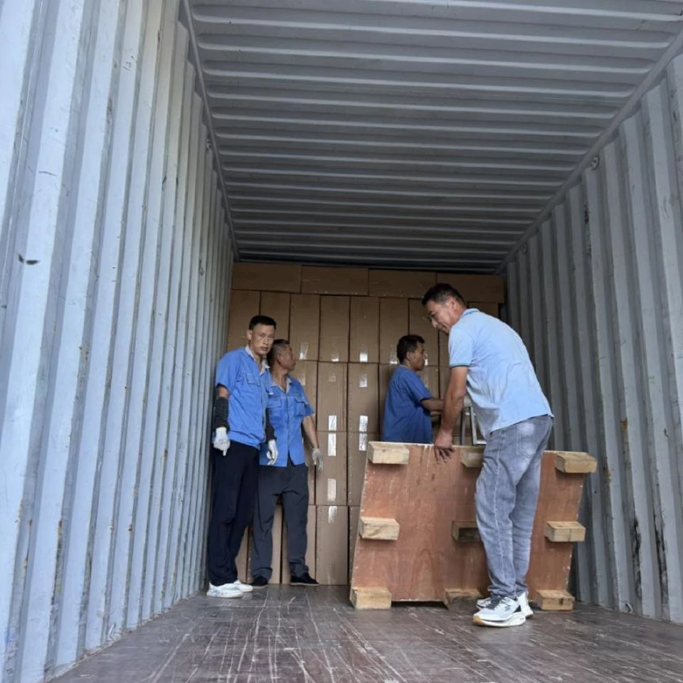 Solar street lights being loaded into a container Solar street lights being loaded into a container